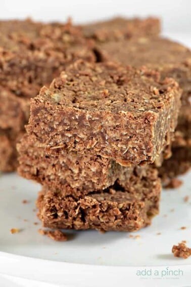 These No Bake Cookie Bars are so simple to make and even more delicious to eat! Made of oats, chocolate, and coconut, these no bake cookie bars are a favorite! // addapinch.com