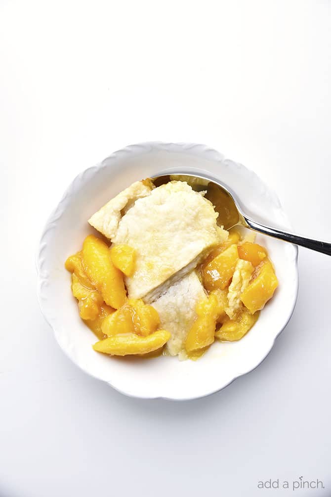 Old Fashioned Southern Peach Cobbler Recipe - Peach Cobbler Recipe โ My Grandmotherโs peach cobbler recipe is a traditional Southern peach cobbler! This heirloom recipe makes the best peach cobbler that has always been a staple in my family for generations. // addapinch.com