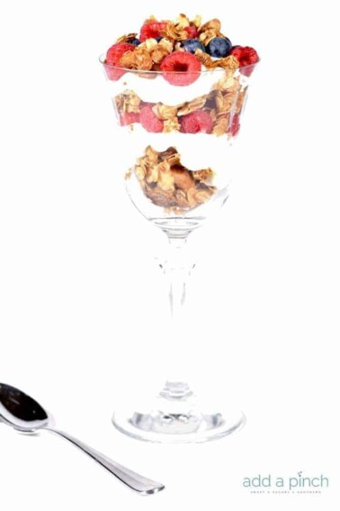 This simple parfait recipe is made of five ingredients and ready in five minutes or less! You’ll make this parfait recipe again and again. // addapinch.com