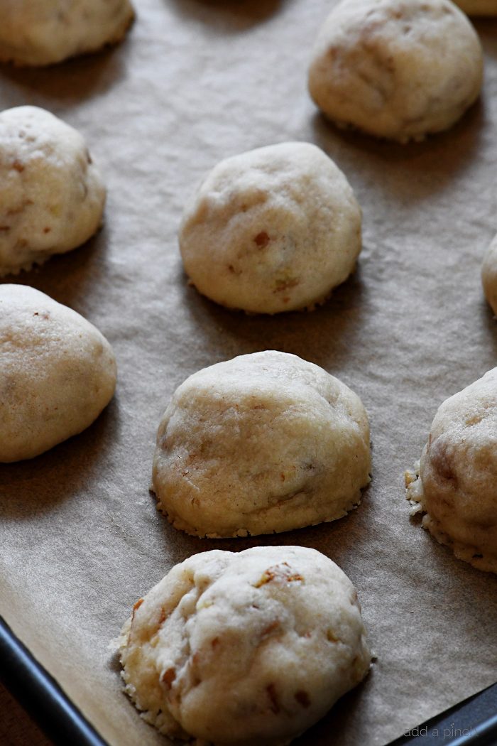Pecan Sandies on parchment covered tray 