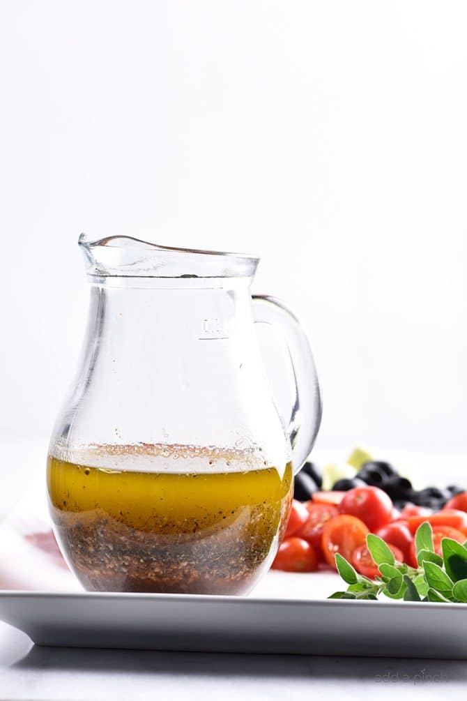 Homemade Italian Dressing Recipe - Homemade Italian Dressing is such a quick and easy salad dressing recipe! Made with olive oil, vinegar, herbs and spices, this Italian Dressing recipe is one that everyone always loves! // addapinch.com