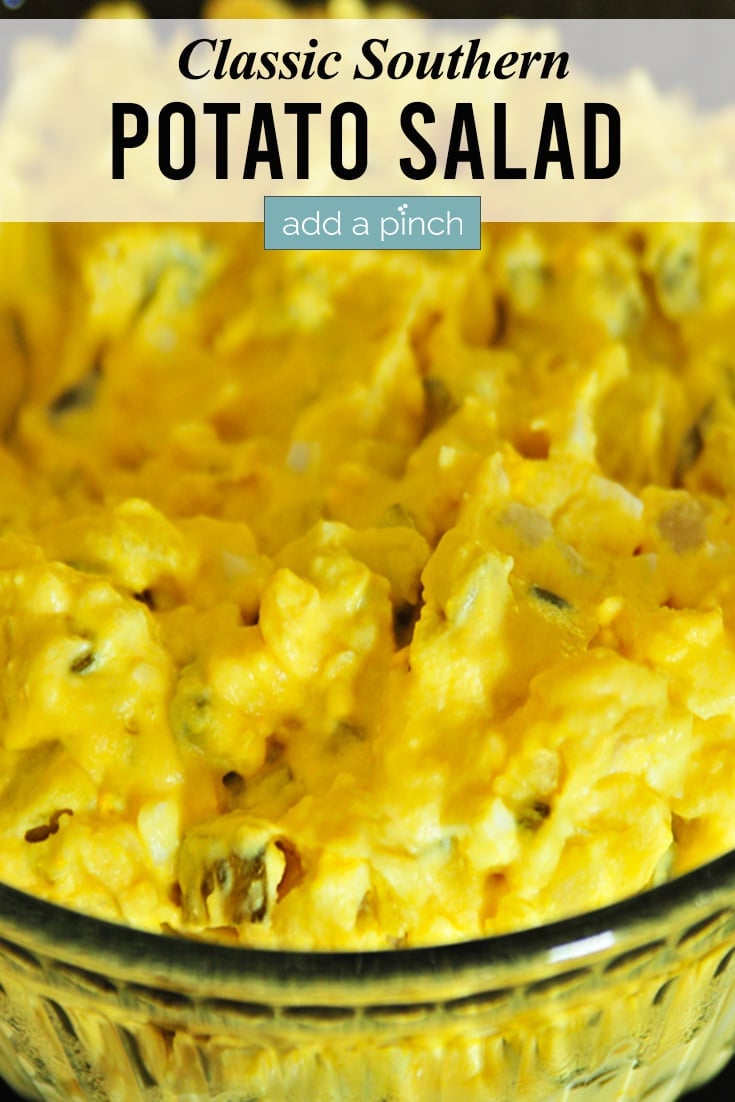 Potato Salad in a glass bowl and text - addapinch.com