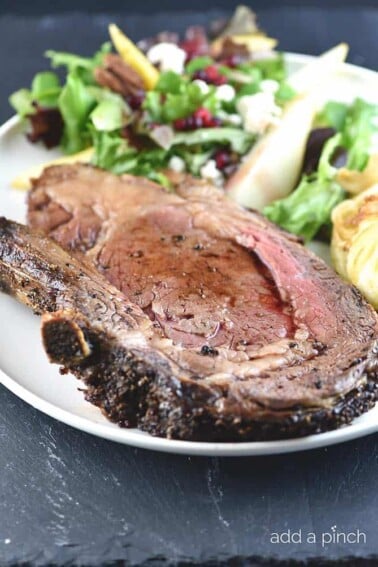Prime Rib on a plate with salad.