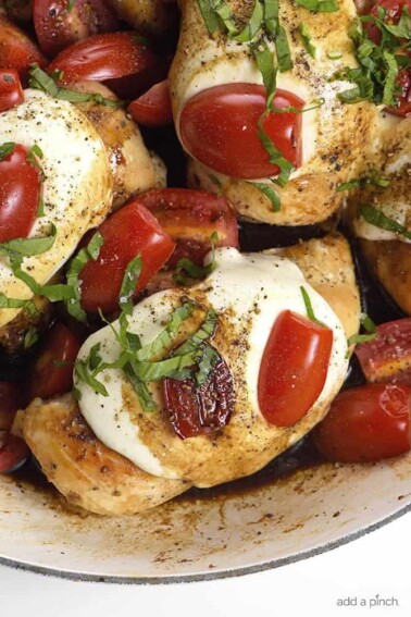 Skillet Caprese Chicken Recipe - This quick and easy chicken recipe is perfect for busy weeknights and delicious enough for entertaining! // addapinch.com