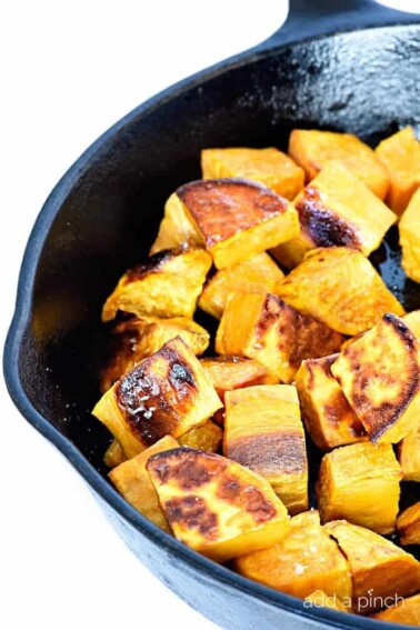 Skillet roasted sweet potatoes make a favorite side dish! Made with just a few ingredients, the skillet makes these sweet potatoes incredibly crisp, yet still tender. // addapinch.com