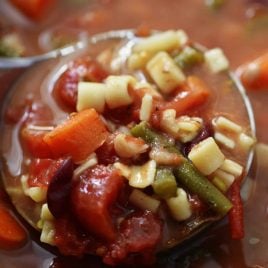 This savory Slow Cooker Minestrone Soup Recipe is full of seasonal vegetables and made even easier in this slow cooker recipe! A delicious family favorite!// addapinch.com