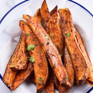 Spicy Sweet Potato Wedges Recipe - Spicy Roasted Sweet Potato Wedges make an easy and delicious recipe! Made with just five ingredients, these roasted sweet potatoes will definitely become a favorite! // addapinch.com