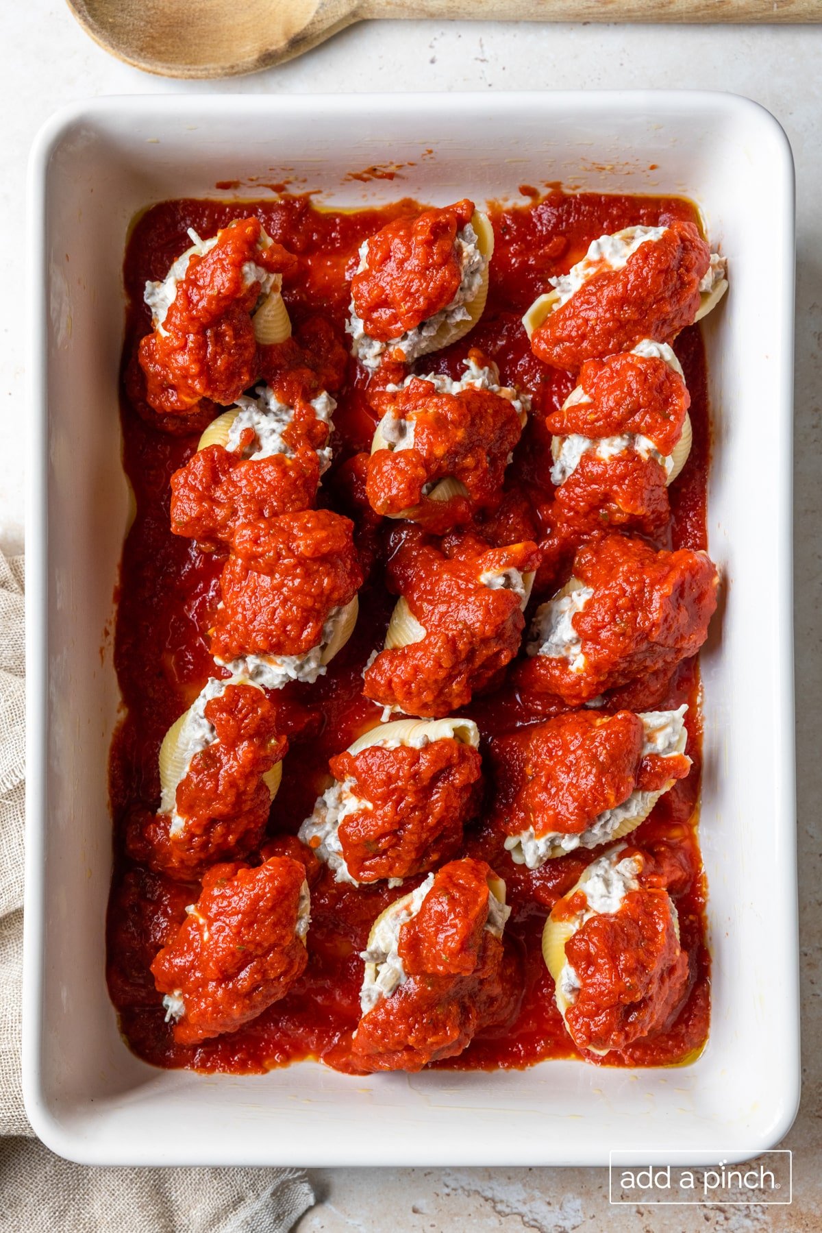 Image of stuffed shells ready to be baked.