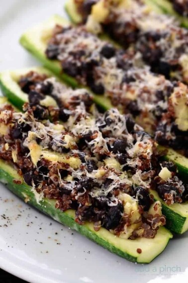 Zucchini halves stuffed with black bean mixture.