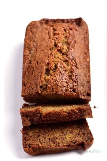 Banana bread on a white platter.