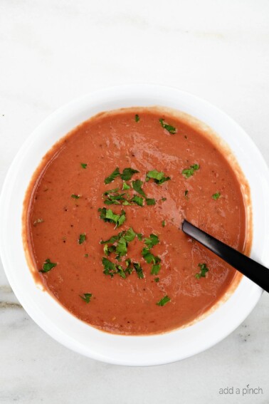 Tomato Soup Recipe - This fresh, homemade tomato soup comes together quickly for a delicious, comforting classic. Ready in 15 minutes!  // addapinch.com