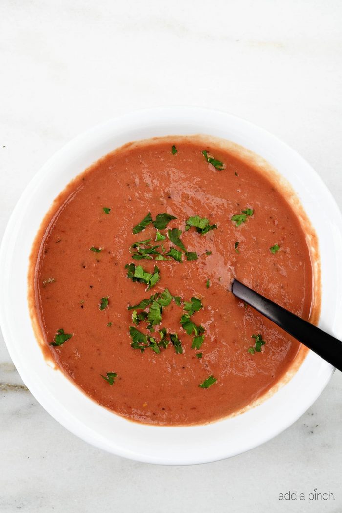 Tomato Soup Recipe - This fresh, homemade tomato soup comes together quickly for a delicious, comforting classic. Ready in 15 minutes!  // addapinch.com